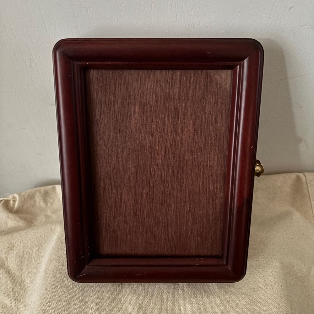 Wooden Frame with photo album in dark brown. Photo album for 24 photos.